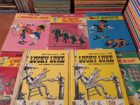 Lucky Luke Bandes dessinées BD Lot de 17 bd abîmées 2$ et +