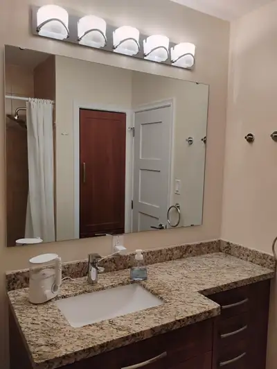 Bathroom vanity with sink, faucet, mirror, cabinet and lighting, View more