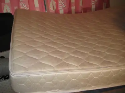 An excellent condition IKEA double size metal bed frame with base slates only asking $180. A foam ma...