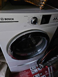 Brand new Bosch gas powered dryer with stand. 