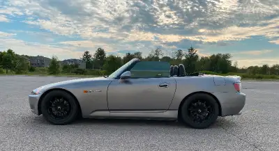 Highlights 2000 Honda S2000, finished in Silverstone Metallic with a black soft top and a black inte...
