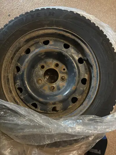 4 Goodyear UltraGrip winter tires on rims. A great winter tire, nice and quiet. Were on a Kia Forte...