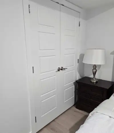 Brand-new fully furnished basement, including a bedroom with a king size bed, a modern bathroom, a c...