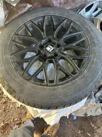 Used car rims with tire on it