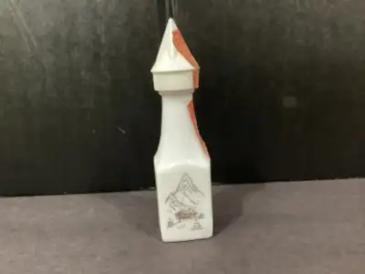 In excellent condition with no chips. Has original plastic cap and USA tax seal. Mountain and cabin...