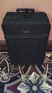 AMERICAN TOURISTER LUGGAGE --- 30-inch suitcase with wheels