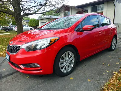 2014 Kia Forte 5 door hatchback in excellent and beautiful overall condition. Red exterior with two...