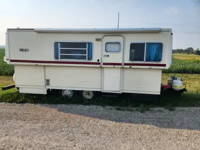 16 foot hi-lo trailer goes up and down with push of a button easy to tow. Has new tires