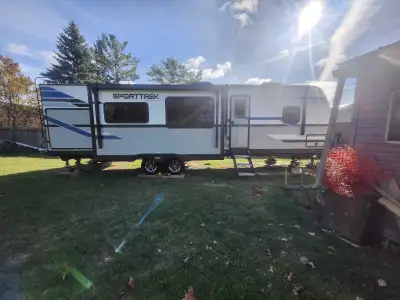 2022 Sporttrek by Venture RV. Near new condition. Parked in campground for duration of ownership. Sl...