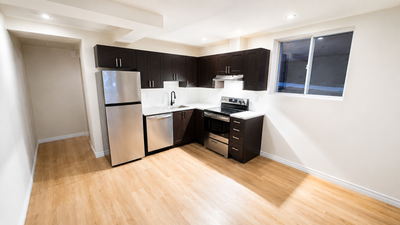 Beautifully renovated one-bedroom, one-bathroom garden-level apartment with large windows that fill...