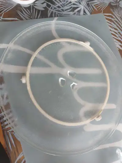 This is a used glass microwave turntable plate complete with rotating ring, ready to bring life back...