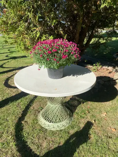 For sale round patio table base is like a plastic fibre glass ,not a cheap table back in the day sti...