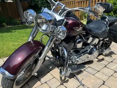 2005 Black Cherry FLSTN with 32.8K Many extras and chrome.
