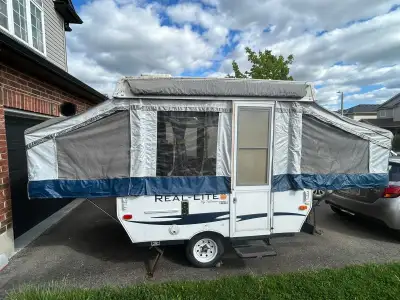 2013 8 foot tent trailer. Queen and a double size heated mattresses on each sides. Stove and a bbq....