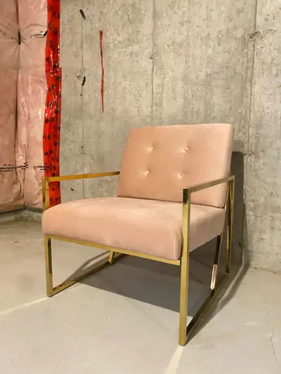 Elevate your living space with this sophisticated modern accent chair, featuring a chic blush pink v...