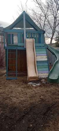 Kid's play structure and with 2 slides and swings