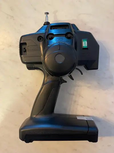 This is a used Tamiya Expec SP RC transmitter in good condition. It is perfect for anyone looking to...