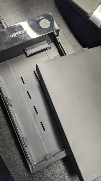 Clearing out some computer bits and pieces — this one's a UGREEN external hard drive enclosure I no...