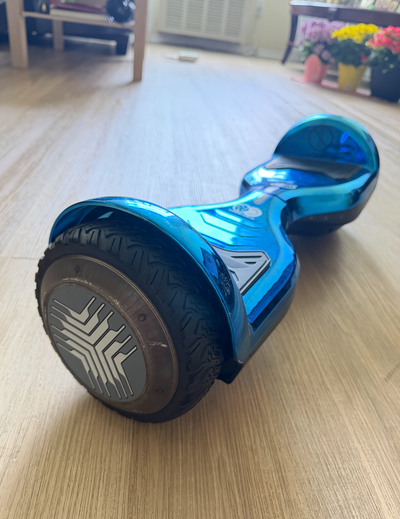 Good condition gyro copter hoverboard. Blue metallic color, with built in bluetooth speakers and LED...