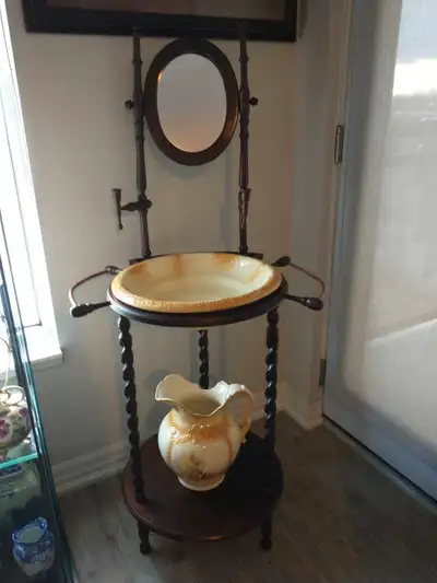 Antique wash bowl and stand, barley twist spindle's, wood swivel mirror. Two candle holders and towe...