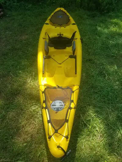Mad river canoe synergy 12 foot fishing kayak very stable and tough as nails. 2 rods holders. 350 lb...