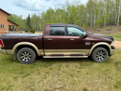 Two tone brown, 1500 Ram Longhorn with toolboxes, tonneau cover and box cargo slide. Includes stock...