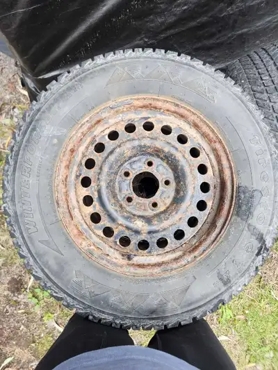 These Firestone Winterforce P235/65R16 winter tires mounted on steel rims are ready to tackle the sn...