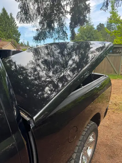 Quality Century flat fiberglass hard tonneau cover off a 2011 Dodge Ram 1500 with the 6’4” box. Fini...