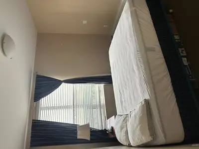 A large bedroom with a view of the South of Calgary and Memorial Drive from Bridgeland (4.5 mt x 4.5...