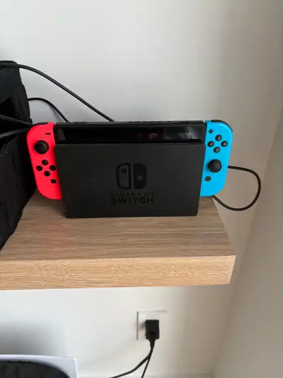 Nintendo Switch, 4 games, 2 joycon for sale all in, View more