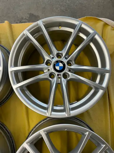 Genuine BMW M-Sport wheels in silver finish. This set of four alloy rims has the iconic five-double-...