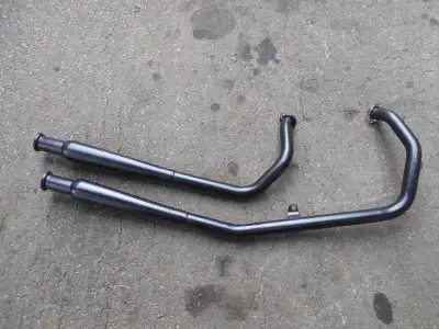 This exhaust is brand new. It is ceramic coated black for durability. It will fit any Evolution moto...
