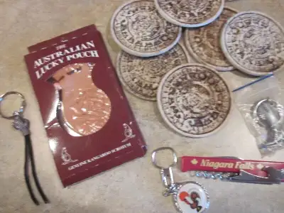 Have a variety of souvenirs brought back from holidays. Includes key chains. Coasters. Cups. All hav...