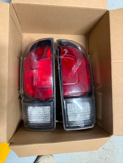 Listing Description: OEM 2016–2023 Toyota Tacoma TRD Pro / Black Trim Taillights (Pair) Selling a se...