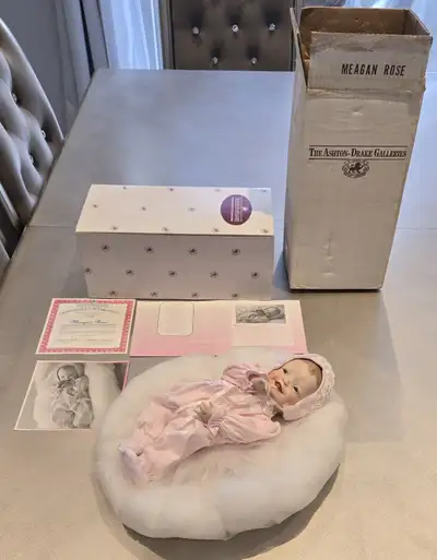 The Ashton-Drake Galleries Porcelain Doll Megan-Rose in pristine condition, Comes with all original...