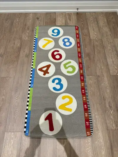 Enhance your child's learning space with this IKEA Hopplek playmat rug, sized at 80x180 cm (2'7"x5'1...