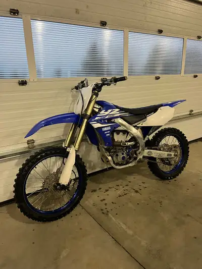63 hrs. Never raced. Also have original seat. Electric start.
