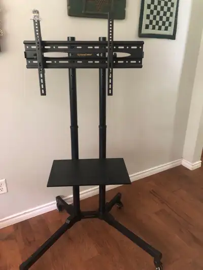 I think it fits 55-75”. I do not have the manual. I think it is good quality and has wheels with bra...