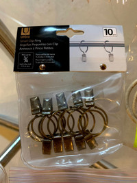 Umbra curtain ring clips, panel holdback sets