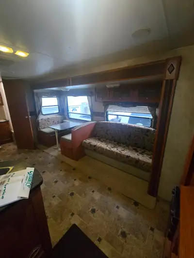 A 2012 rv with a queen bed and 2 bunks. The unit comes with a slide out ,a new awning and brand new...