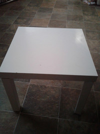 2 white Ikea tables asking $25 each