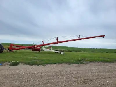 Farm King 1370 grain auger for sale. Hydraulic hopper mover with electric winch. $8,000 obo. Text 25...