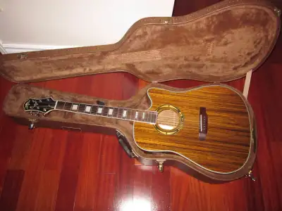 Offering a Carparelli " Spirit of 69" guitar. This limited edition Zebrawood guitar is number 2 of 1...