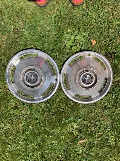 Two matching vintage hubcaps. Disregard the red camera flash across the pictures. Asking $10 each. P...