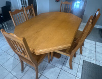 Solid oak table & 6 chairs.