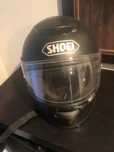 I'm selling a used Shoei motorcycle helmet, providing reliable protection on the road. It has a slee...