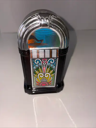 1970s vintage Avon jukebox-shaped glass decanter. Contains original "Sweet Honesty" cologne. The bot...