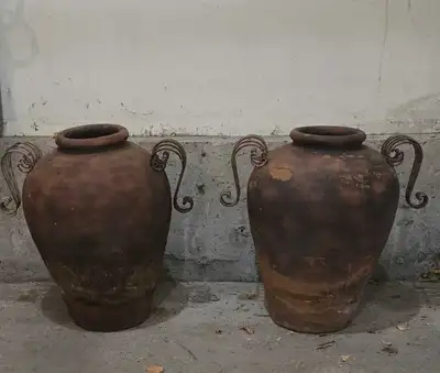 PAIR OF LARGE VINTAGE RUSTIC EARTHENWARE VESSELS WITH ORNATE METAL HANDLES CALLED "PITHOS". THESE WE...