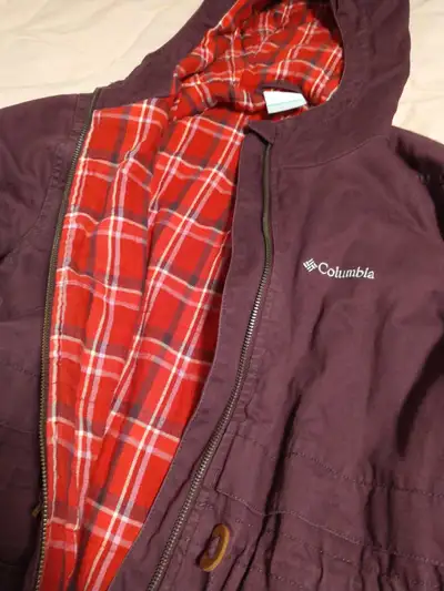 Warm, fall Columbia jacket. Dark purple shell, red plaid interior. Zipper closure, with 2 exterior b...