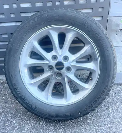 Chrysler 300M 17 “ Rim in great condition, Tire has one season left with no cracks. 225X55 R17. Aski...